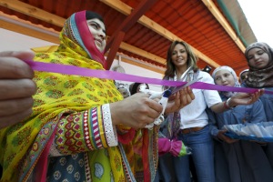 Nobel Peace Prize laureate Malala Yousafzai (L) cuts a ribbon near Noura Jumblatt (R), founder of the NGO Kayany Foundation, at a school for Syrian refugee girls, built by the foundation, in Lebanon's Bekaa Valley July 12, 2015. Malala, the youngest winner of the Nobel Peace Prize, celebrated her 18th birthday in Lebanon on Sunday by opening the school and called on world leaders to invest in 
